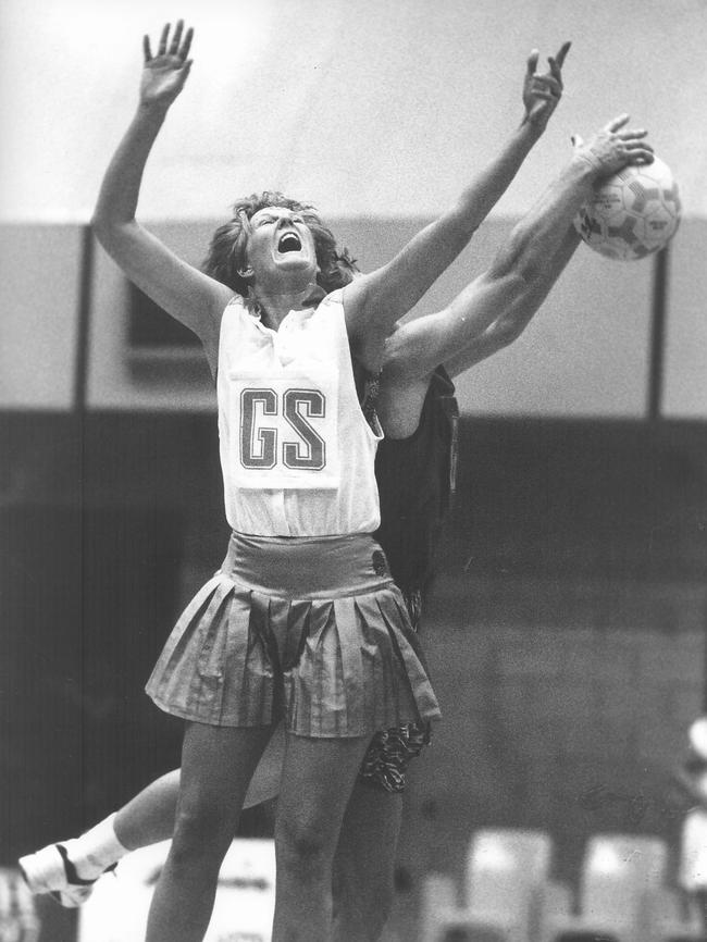 NSW goal shooter Nicole Cusack mid-action during a netball match against South Australia at the Australian Netball Championships held at Marrara Indoor Stadium. Circa: 10/1993.