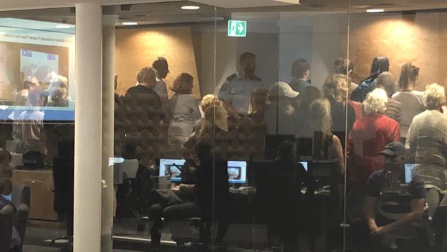 Black Swan Lake protesters turn their back on Mayor Tom Tate at a council meeting this morning.