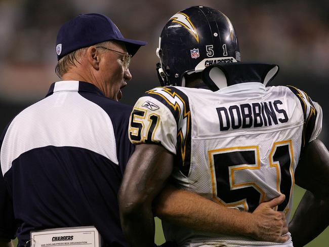 Marty Schottenheimer gives sideline instructions to Tim Dobbins during a game against the Chicago Bears in 2006. (Photo by Jonathan Daniel/Getty Images)