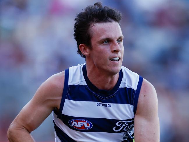 GEELONG, AUSTRALIA - MARCH 01: Max Holmes of the Cats in action during the 2024 AFL AAMI Community Series match between the Geelong Cats and Essendon Bombers at GMHBA Stadium on March 01, 2024 in Geelong, Australia. (Photo by Michael Willson/AFL Photos via Getty Images)