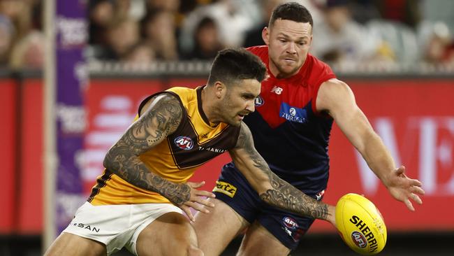 MELBOURNE, AUSTRALIA - APRIL 30: Chad Wingard of the Hawks and Steven May of the Demons compete during the round seven AFL match between the Melbourne Demons and the Hawthorn Hawks at Melbourne Cricket Ground on April 30, 2022 in Melbourne, Australia. (Photo by Darrian Traynor/AFL Photos/Getty Images)