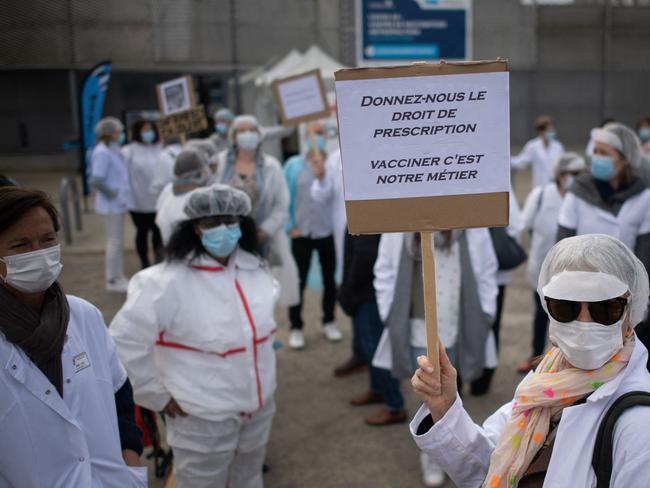 Dozens of private nurses protest for the right to vaccinate against COVID-19 in front of a vaccination centre in Nantes, western France. Picture: AFP