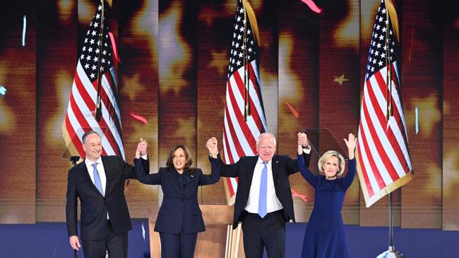 US Vice-President and Democratic presidential candidate Kamala Harris with Second Gentleman Doug Emhoff, Minnesota Governor and Democratic vice-presidential candidate Tim Walz and his wife Gwen Walz at the final night of the DNC.