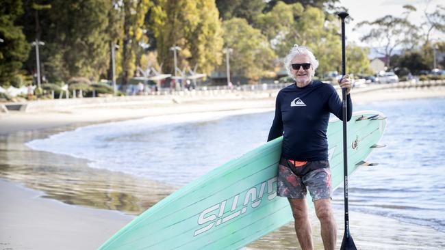 Steven Last felt like he was dancing on water after paddle boarding in perfect weather conditions at Long Beach, Sandy Bay. Picture: Chris Kidd