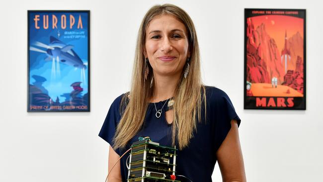 EAB member Flavia Tata Nardini with a Nanosatellite at Fleet Space Technologies.