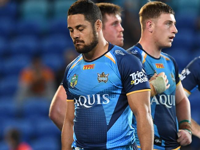 Titans player Jarryd Hayne is dejected during the round 21 NRL match between the Gold Coast Titans and the West Tigers at CBUS Stadium on the Gold Coast, Sunday, July 30, 2017.  (AAP Image/Dave Hunt) NO ARCHIVING, EDITORIAL USE ONLY