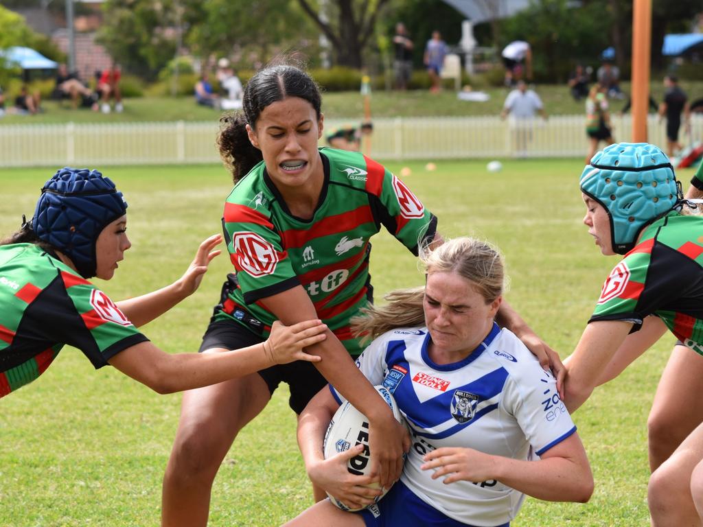Jayde Freeman is tackled by Lani Anderson (left) and Sophia Brightwell (right). Picture: Sean Teuma. Lisa Fiaola Cup