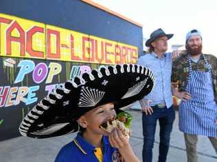 POP UP TACOS: Jayden Morris, 9, enjoys a taco at the pop-up Taco Love Bros shop in Lismore where proprietors Jordan and Dylan Morris are providing pop-up tacos for Lismore. Picture: Marc Stapelberg