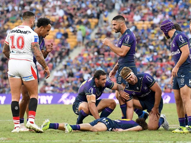 Ryan Papenhuyzen lies prone after being knocked out during the round 10 NRL match between the Melbourne Storm and the St George Illawarra Dragons. Picture: Bradley Kanaris/Getty Images