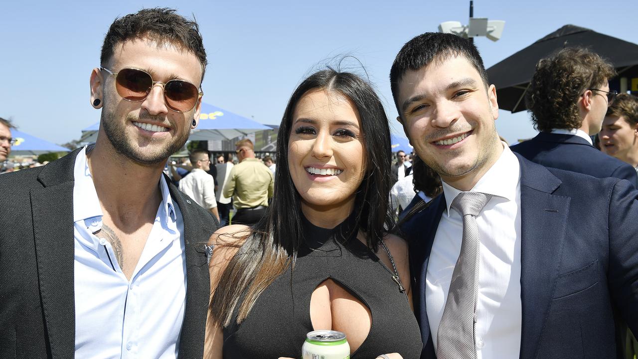 Caulfield Guineas horse race meeting, Caulfield, Victoria, Saturday 12th October 2024. Faces in the crowd. Pictured enjoying the race meeting are Michael, Steph and Michael. Picture: Andrew Batsch