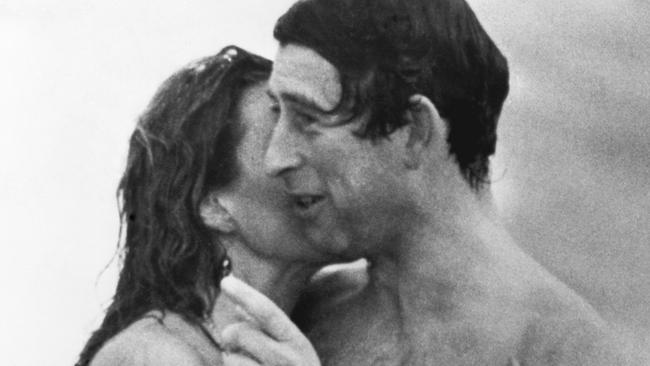 Prince Charles is kissed by Jane Priest, a model, as he emerges from the water at Cottesloe beach in Perth, during his 1979 tour of Australia. (Photo by ÃÂ© Hulton-Deutsch Collection/CORBIS/Corbis via Getty Images)