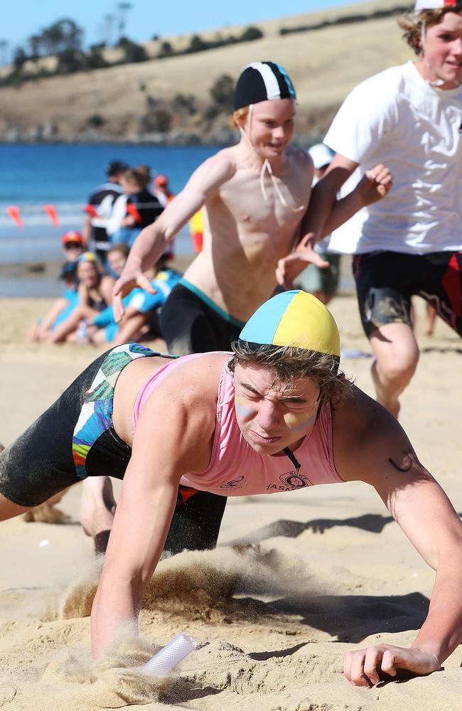 Liam Duffy 14 of Kingston Beach Surf Life Saving Club in the u/15 mens beach flags event. Tasmanian Surf Lifesaving Championships at Clifton Beach. Picture: NIKKI DAVIS-JONES