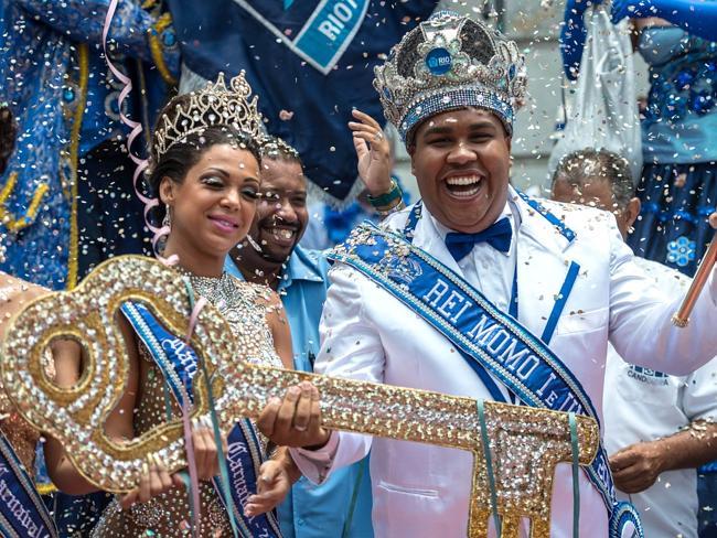 King Momo, Wilson Dias da Costa Neto, receives the key to the city with Queen Leticia Martins Guimaraes at the official opening of the world-famous Rio carnival.