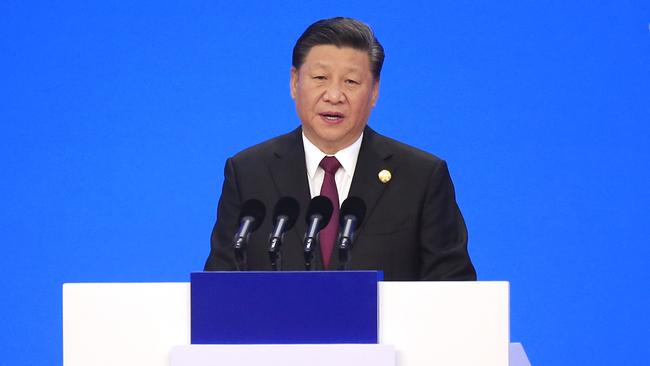 Xi Jinping promised to ‘embrace the world’ in a speech that mentioned the word ‘open’ more than 50 times in Shanghai yesterday. Picture: AP