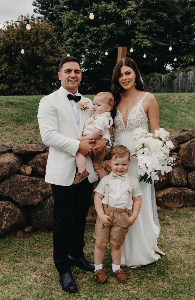 Kodi Nikorima and Bree Tobler on their wedding day with sons Zavier and Elijah. Photo: Courtney, Black Palm Collective