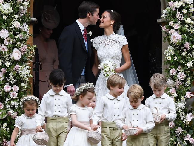 Pippa Middleton kisses her new husband James Matthews, following their wedding ceremony at St Mark's Church. Picture: Getty