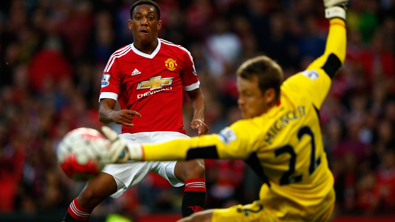 MANCHESTER, ENGLAND - SEPTEMBER 12: Anthony Martial of Manchester United scores past Simon Mignolet of Liverpool for his team's third goal during the Barclays Premier League match between Manchester United and Liverpool at Old Trafford on September 12, 2015 in Manchester, United Kingdom. (Photo by Shaun Botterill/Getty Images) *** BESTPIX ***