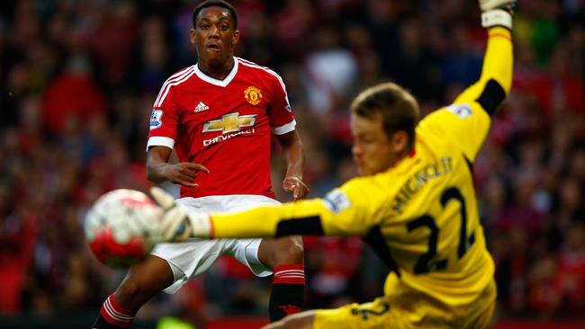 MANCHESTER, ENGLAND - SEPTEMBER 12: Anthony Martial of Manchester United scores past Simon Mignolet of Liverpool for his team's third goal during the Barclays Premier League match between Manchester United and Liverpool at Old Trafford on September 12, 2015 in Manchester, United Kingdom. (Photo by Shaun Botterill/Getty Images) *** BESTPIX ***