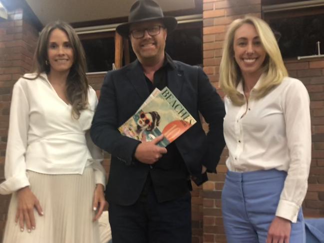 About 200 people attended a debate at Mona Vale Memorial Hall on Thursday, including independent, Jacqui Scruby (left) and Liberal, Georgia Ryburn (right) with Beaches Covered magazine publisher John Vickery. Picture: Jim O’Rourke