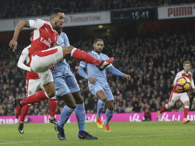 Arsenal's Theo Walcott scores.