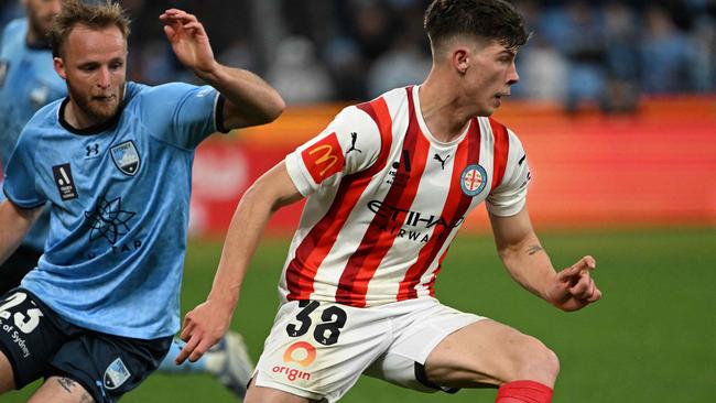 Sydney's Rhyan Grant (L) and Melbourne's Jordan Bos fight for the ball during the A-League Men semi-final first leg football match between Sydney FC and Melbourne City at Allianz Stadium in Sydney on May 12, 2023. (Photo by Saeed KHAN / AFP) / -- IMAGE RESTRICTED TO EDITORIAL USE - STRICTLY NO COMMERCIAL USE --