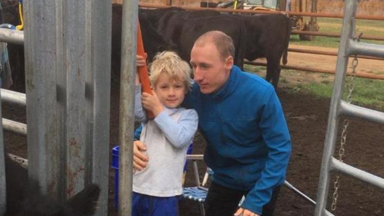 Jockey William Pike on his cattle property with his son Jett