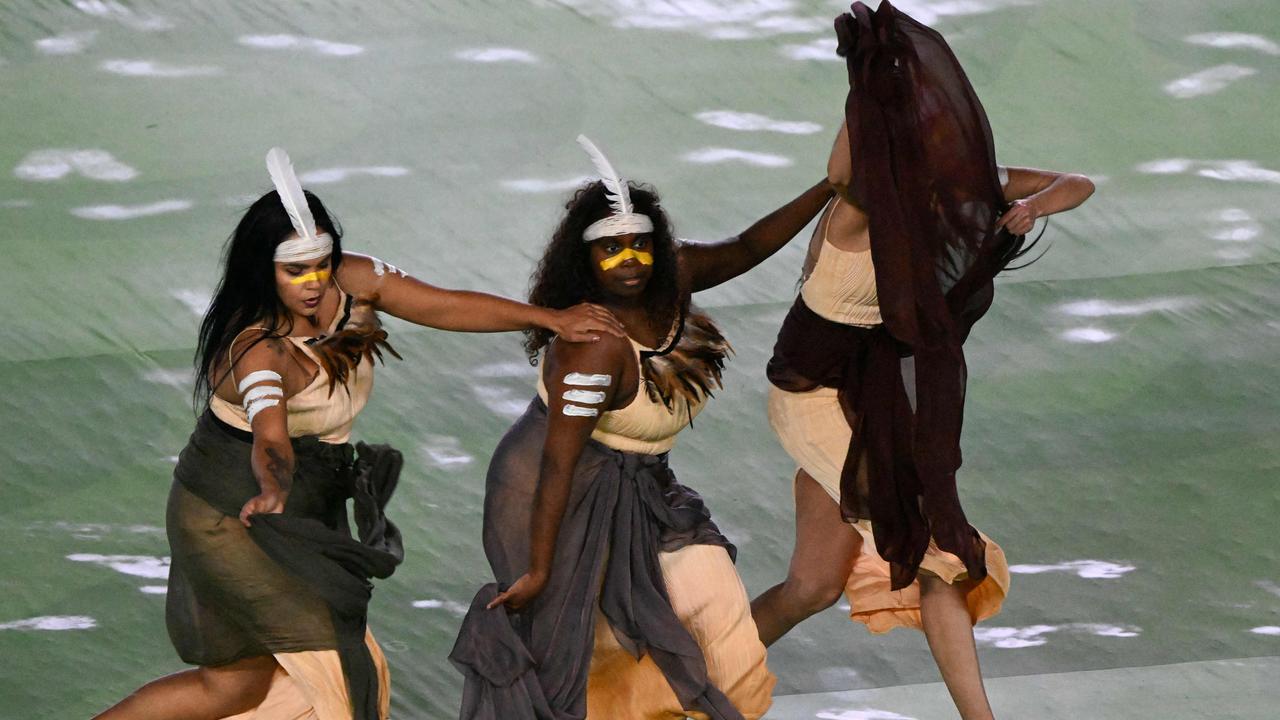 Members of the Tjarutja Dance Theatre Collective take part in the opening ceremony. Picture: Saeed KHAN / AFP.