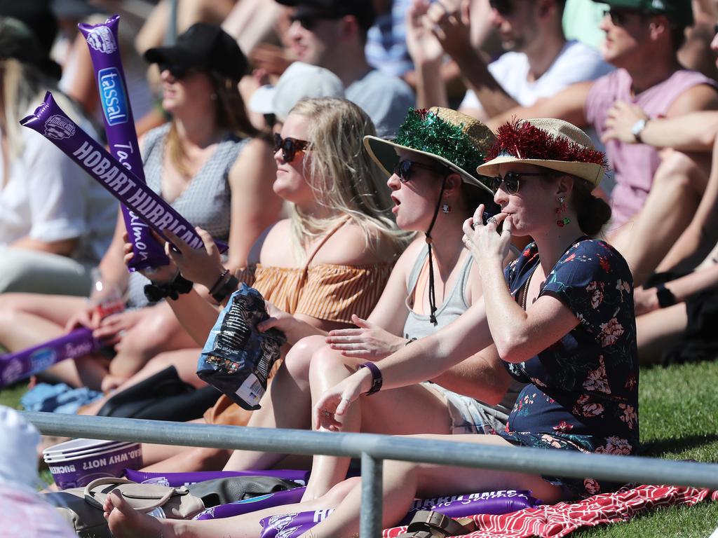 Fans enjoying the hot weather at the Big Bash match between the Hurricanes and Melbourne Stars at Blundstone Arena on Christmas Eve. Picture: LUKE BOWDEN