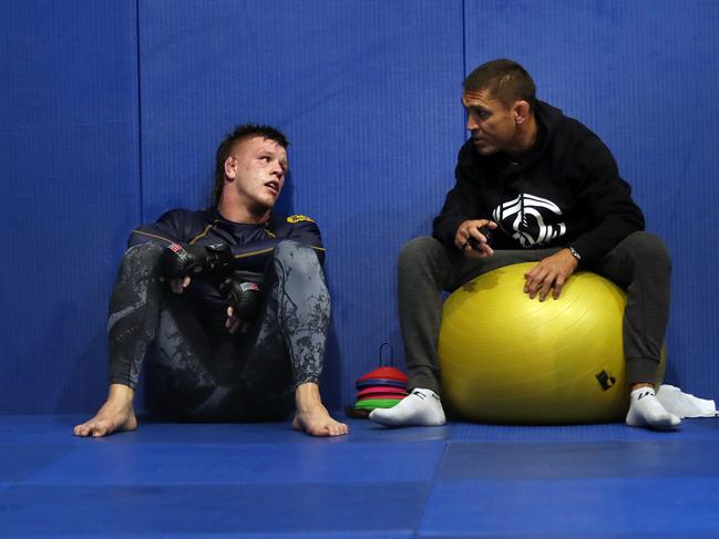 Aussie UFC star Jimmy Crute with his trainer Alex Prates pictured at the Gracie Jiu Jitsu gym at Smeaton Grange. Picture: Richard Dobson