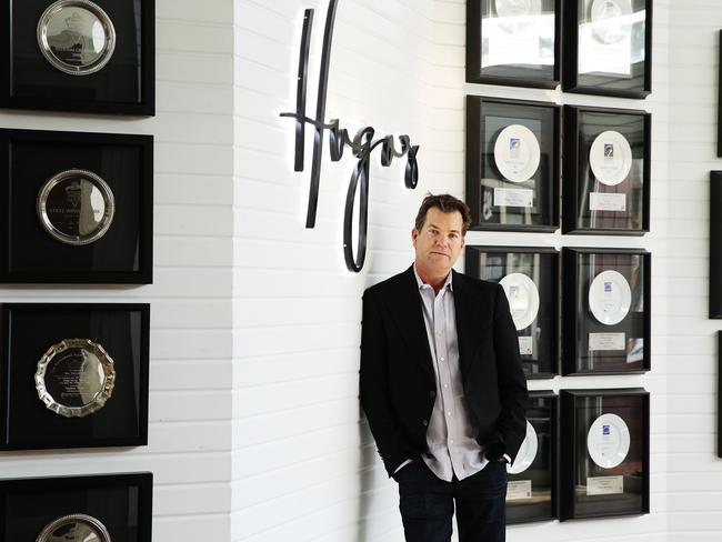 Dave Evans admires the trophies of Hugos Kings Cross, now on the wall in the group’s Manly venue, which will remain unaffected by the closure of the Bayswater Rd bar. Picture: Braden Fastier