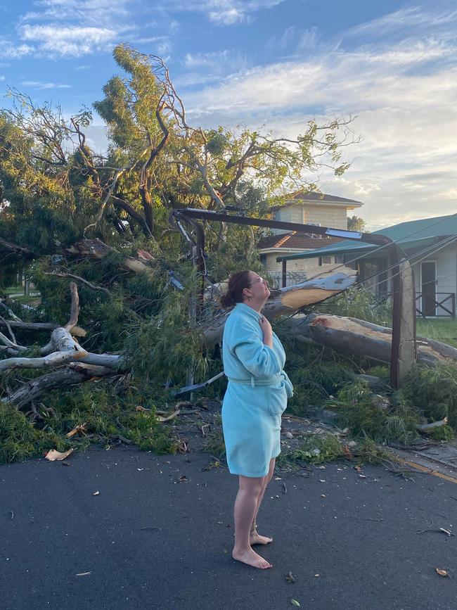 Milly Wise, of Modbury, surveys the buckled mess caused by the big tree.