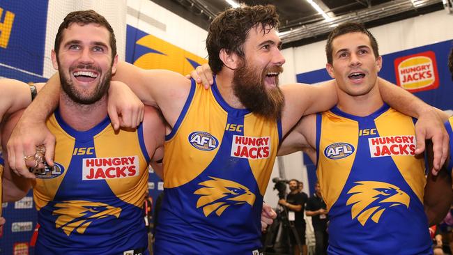 Eagles players Jack Darling, Josh Kennedy and Liam Duggan have some new lyrics to learn.