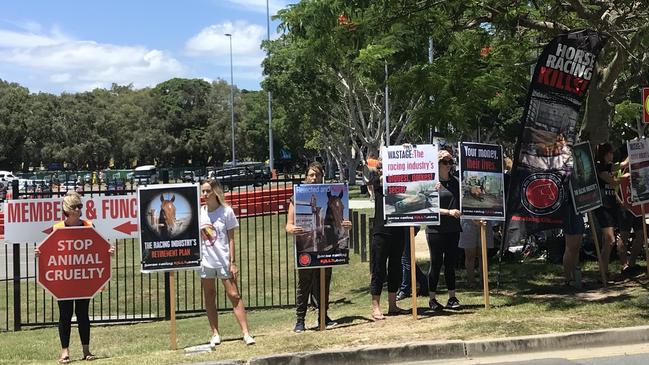 Armed with signs and banners, the group has set up shop outside the Gold Coast Turf Club. Photo: Emily Halloran