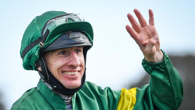 Willie Pike returns to the mounting yard after winning the Caulfield Guineas on Ole Kirk and giving him four winners for the day. Picture: Racing Photos via Getty Images