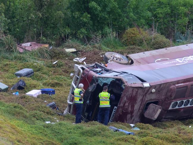 MELBOURNE, AUSTRALIA- SEPTEMBER 21 A school bus carrying 32 people has flipped on the Western Highway in Bacchus Marsh. Police are investigating the crash between a school bus and a truck that occured at around 3.15am. Picture: Brendan Beckett Loreto College