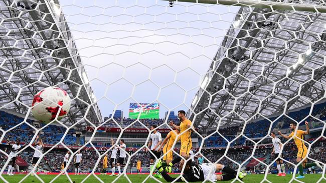 Australia's forward Tomi Juric scores a goal past Germany's goalkeeper Bernd Leno during the 2017 Confederations Cup group B football match between Australia and Germany.