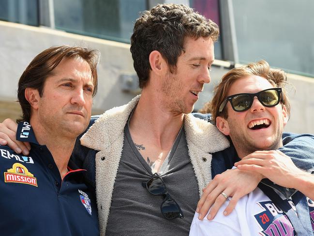 MELBOURNE, AUSTRALIA - OCTOBER 02:  Luke Beveridge, Robert Murphy and Caleb Daniel of the Bulldogs embrace during the Western Bulldogs AFL Grand Final celebrations at Whitten Oval on October 2, 2016 in Melbourne, Australia. The Western Bulldogs defeated the Sydney Swans in yesterday's AFL Grand Final.  (Photo by Quinn Rooney/Getty Images)