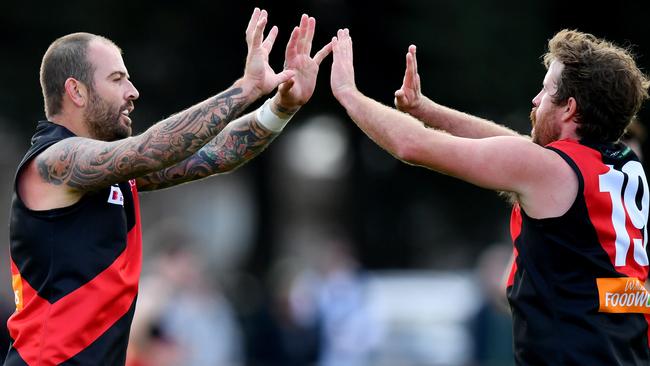 Dean Galea and Haydn Ross celebrate a goal for Riddell. Picture: Josh Chadwick