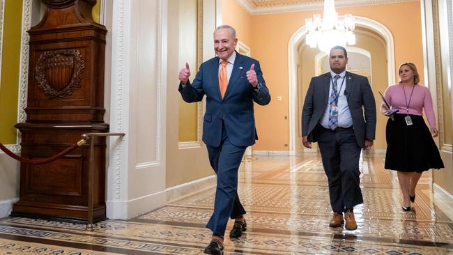 Senate Majority Leader Chuck Schumer walks to the Senate chamber following passage of a short-term funding bill.