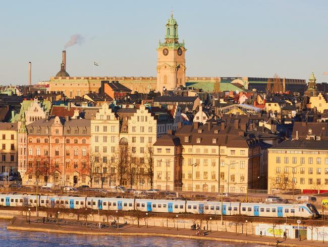 GEGJC1 Train passing Gamla Stan Stockholm's old town Sweden ScandinaviaPhoto - AlamyEscape 2 April 2023Europe rail