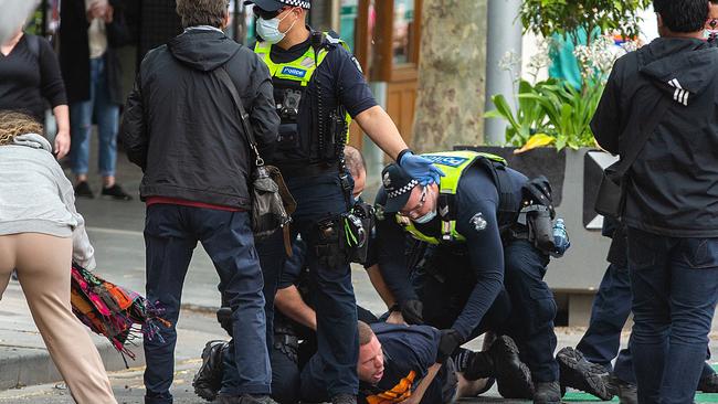 He was seen being arrested after hopping on the police car. Picture: NCA NewsWire/Sarah Matray