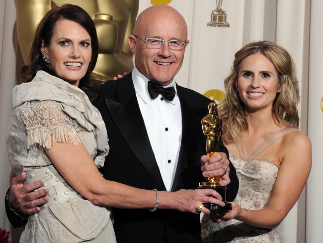 Best Supporting Actor Winner Heath Ledger’s family, mother Sally, father Kim and sister Kate, pose with the Oscar he won for his role in The Dark Knight. Picture: Mark Ralston/AFP