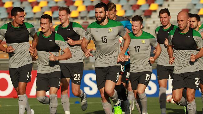 Australian Socceroos training at Nathan for match against China in the AFC. #15 Mile Jedinak leads the team run. PIC MARC ROBERTSON.