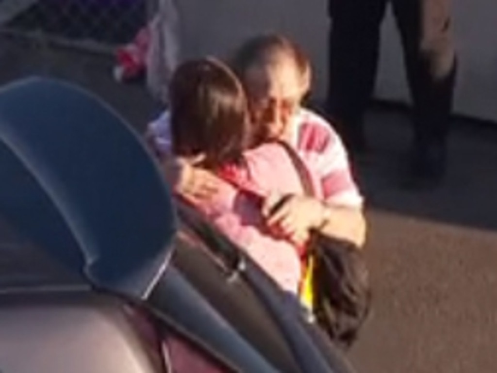 Tanya Sandoe hugs her father David Sandoe after arriving at Sydney Airport. (Sky News)