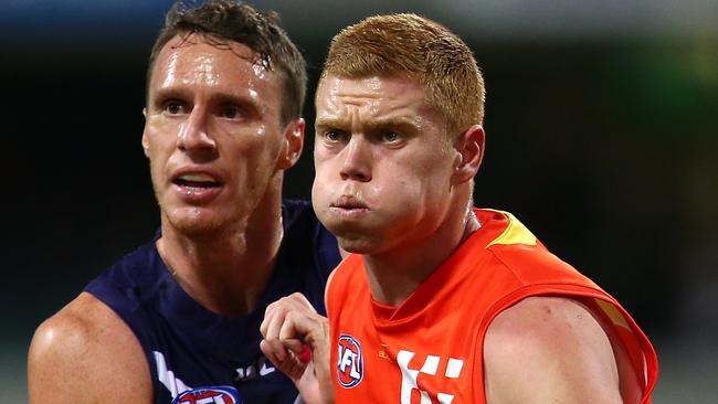 Peter Wright of the Suns and Jonathon Griffin of the Dockers contest the ruck during the round 20 AFL match between the Fremantle Dockers and the Gold Coast Suns at Domain Stadium on August 5, 2017 in Perth, Australia. (Photo by Paul Kane/Getty Images)