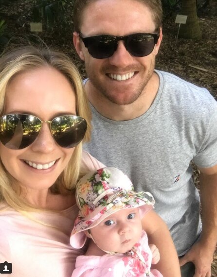 Wests Tigers co-captain Chris Lawrence with baby Emmerson and wife Kathryn.