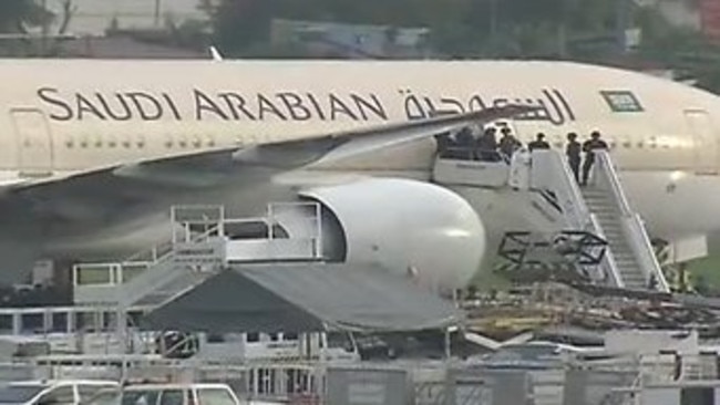 Saudi Arabia Airlines Flight SV 872 sits in an isolated corner of Manila International airport.