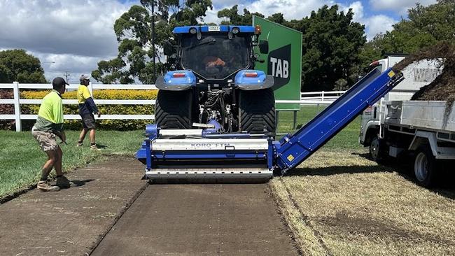 Work underway last week to remove the poisoned section of track at the Gold Coast Turf Club and replace it before the Magic Millions, which was subsequently washed out. Picture: Supplied