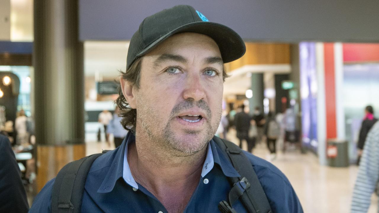 Mr Wright was trailed by his partner carrying their newborn baby as he made his way through the airport on Tuesday. Picture: Liam Mendes / The Australian