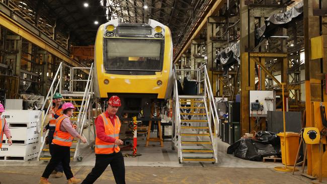 Workers inside the Downer Rail Manufacturing Facility at Maryborough. Picture: Lachie Millard